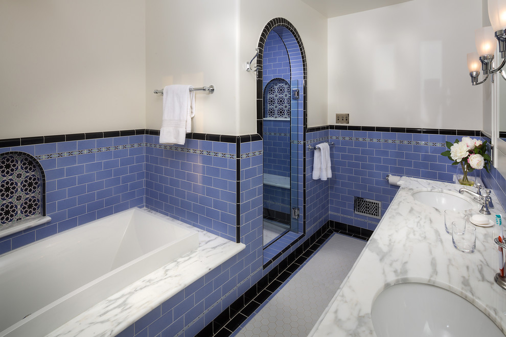 Inspiration for a large mediterranean ensuite bathroom in Los Angeles with a submerged sink, shaker cabinets, white cabinets, marble worktops, a built-in bath, an alcove shower, a two-piece toilet, blue tiles, ceramic tiles, white walls and ceramic flooring.