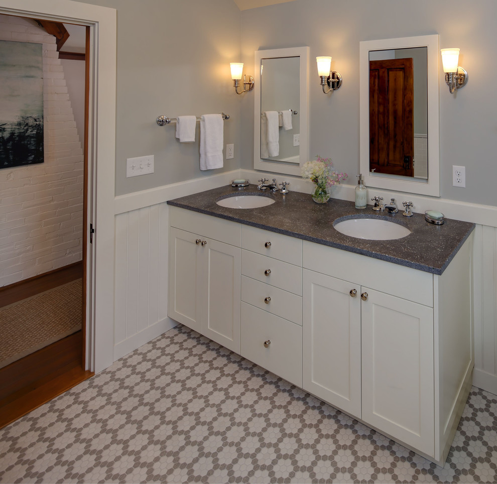 This is an example of a medium sized traditional ensuite bathroom in Portland Maine with shaker cabinets, white cabinets, grey tiles, grey walls, mosaic tile flooring, a submerged sink and engineered stone worktops.