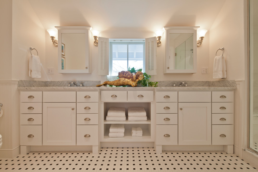 Example of a large classic master ceramic tile and multicolored floor alcove shower design in Boston with flat-panel cabinets, white cabinets, marble countertops, white walls and an undermount sink
