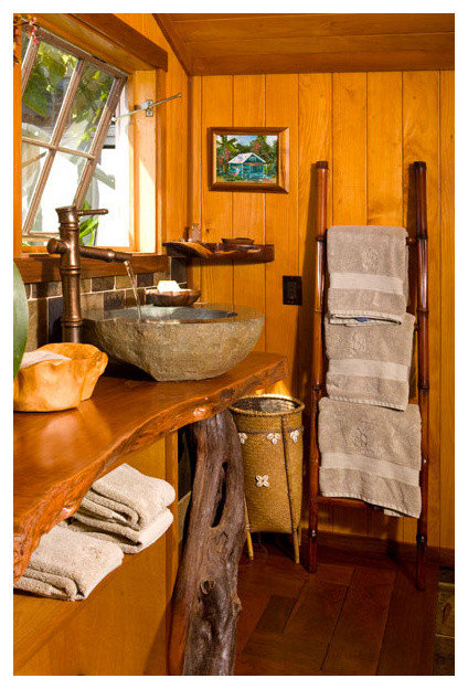 Medium sized world-inspired ensuite bathroom in Hawaii with open cabinets, medium wood cabinets, a japanese bath, a walk-in shower, grey tiles, pebble tiles, grey walls, slate flooring, a vessel sink, wooden worktops, grey floors and an open shower.