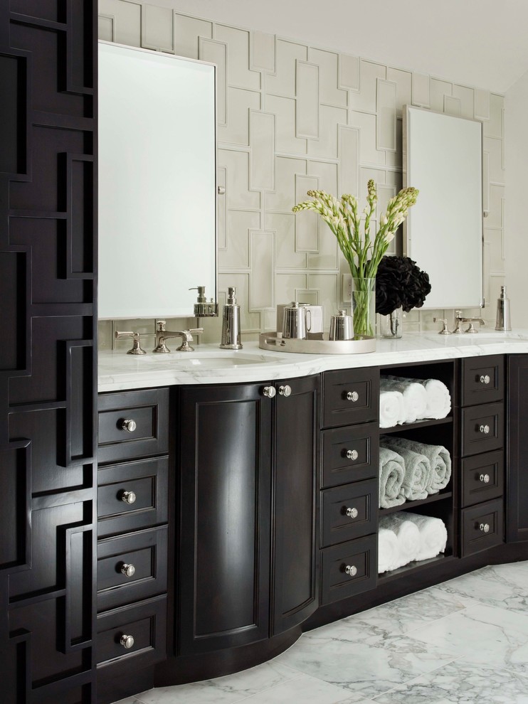 Example of a transitional white tile marble floor bathroom design in Los Angeles with white walls, an undermount sink, recessed-panel cabinets and dark wood cabinets