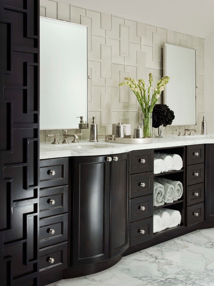 Design ideas for a classic bathroom in Los Angeles with white tiles, white walls, marble flooring, a submerged sink, recessed-panel cabinets and dark wood cabinets.