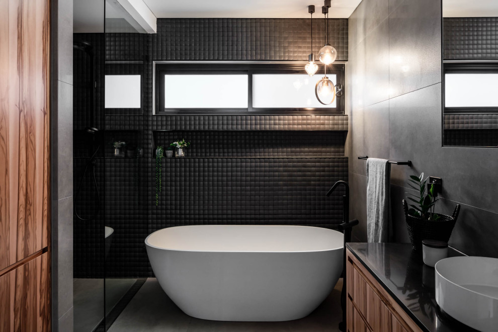 Inspiration for a contemporary black tile and mosaic tile gray floor and single-sink bathroom remodel in Sydney with flat-panel cabinets, medium tone wood cabinets, a vessel sink, black countertops and a built-in vanity