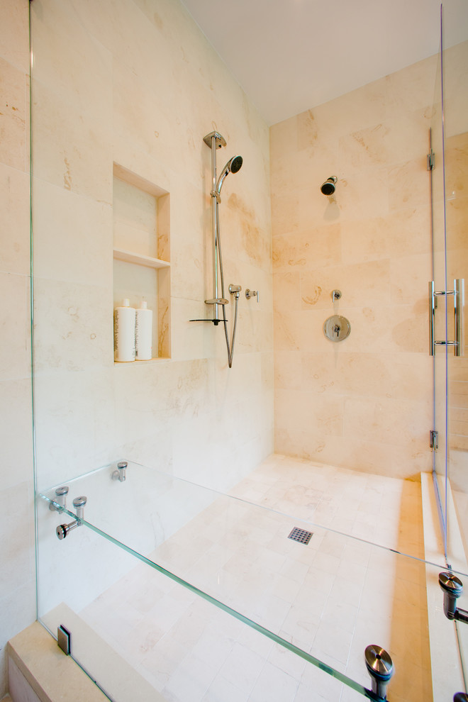 Mid-sized trendy master beige tile and ceramic tile ceramic tile and beige floor bathroom photo in DC Metro with flat-panel cabinets, medium tone wood cabinets, an undermount tub, beige walls, an undermount sink, solid surface countertops, a hinged shower door and a niche