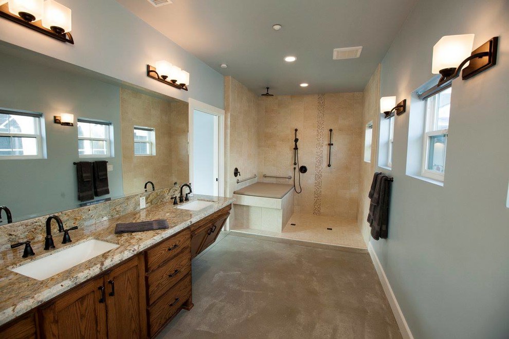Inspiration for a large cottage master brown tile and ceramic tile concrete floor doorless shower remodel in San Diego with shaker cabinets, medium tone wood cabinets, a one-piece toilet, white walls, a drop-in sink and granite countertops