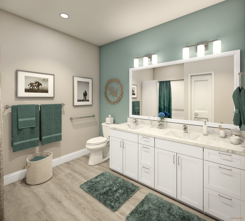 Foto på ett mellanstort vintage vit en-suite badrum, med luckor med infälld panel, vita skåp, en toalettstol med hel cisternkåpa, gröna väggar, laminatgolv, ett integrerad handfat, granitbänkskiva och grått golv