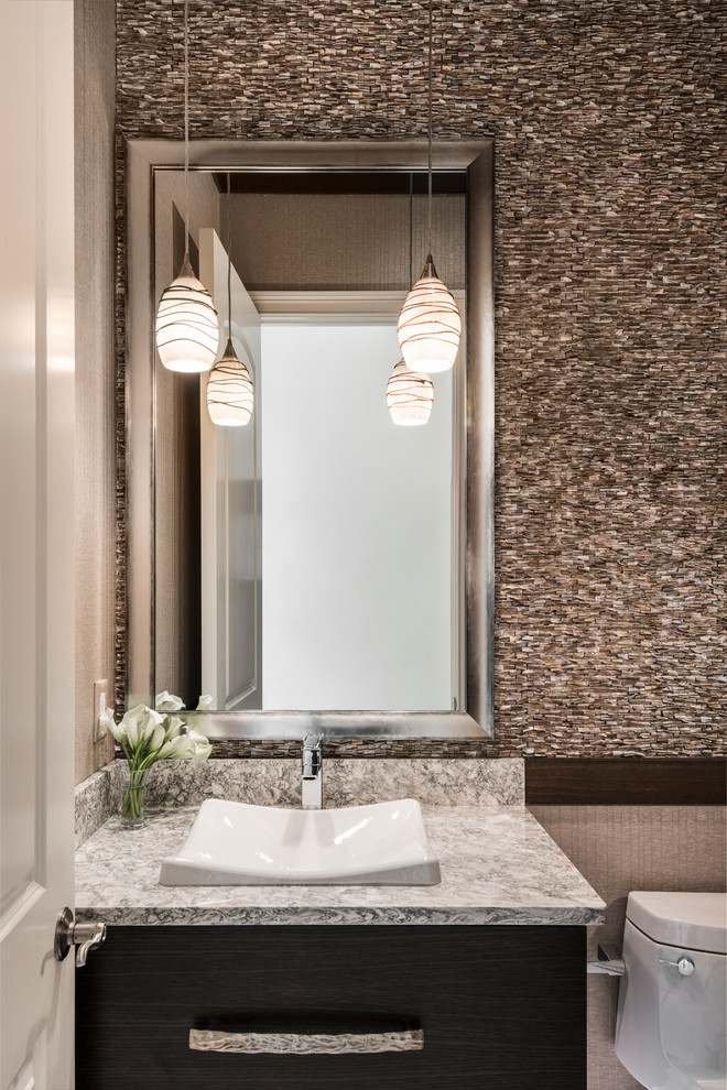 Small transitional master brown tile porcelain tile and multicolored floor bathroom photo in Miami with flat-panel cabinets, light wood cabinets, a one-piece toilet, multicolored walls, a drop-in sink and marble countertops