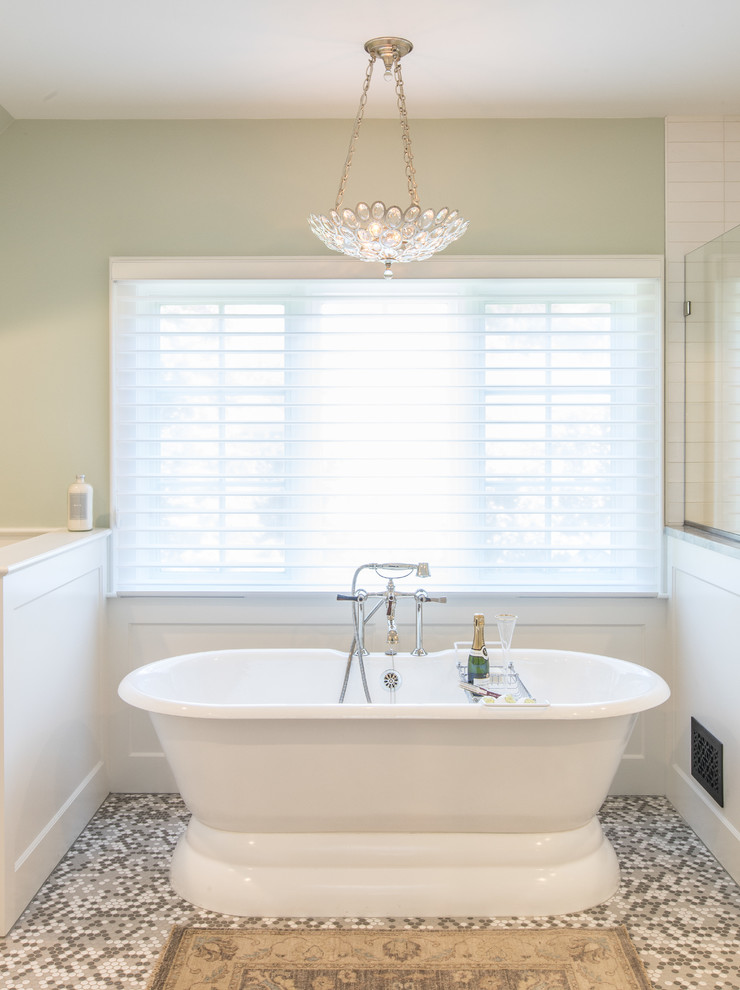 Medium sized traditional ensuite bathroom in Detroit with freestanding cabinets, white cabinets, a freestanding bath, an alcove shower, a two-piece toilet, white tiles, metro tiles, green walls, mosaic tile flooring, a submerged sink, quartz worktops, multi-coloured floors, a hinged door and grey worktops.