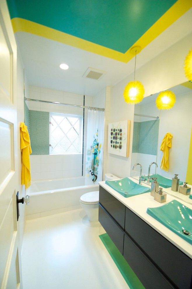 Example of a mid-sized trendy kids' white tile white floor bathroom design in Seattle with a drop-in sink, flat-panel cabinets, dark wood cabinets and white walls