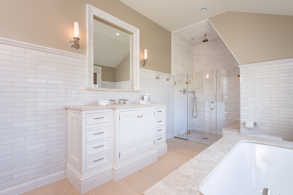 Beach style white tile and stone tile alcove shower photo in Los Angeles with an undermount sink, furniture-like cabinets, white cabinets, an undermount tub and beige walls