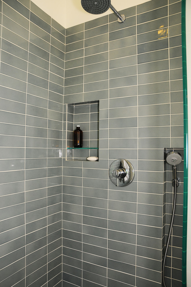 Inspiration for a 1960s blue tile and ceramic tile corner shower remodel in Seattle