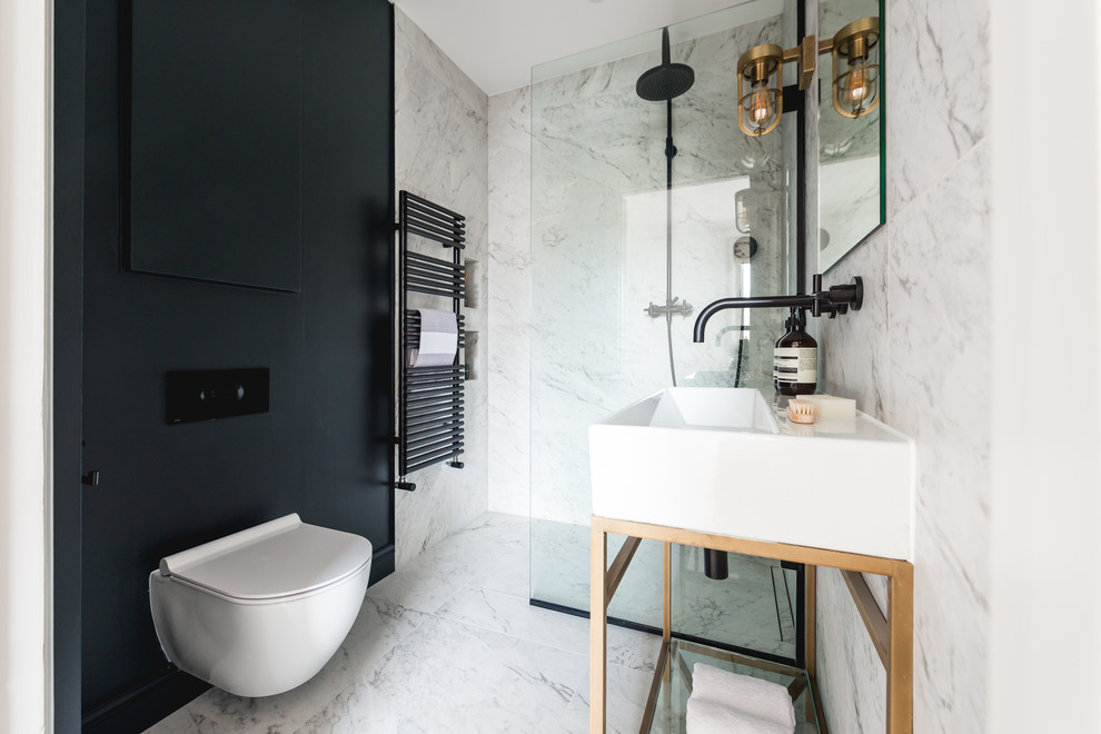 This is an example of a small contemporary shower room bathroom in London with flat-panel cabinets, blue cabinets, a walk-in shower, a one-piece toilet, black and white tiles, marble tiles, grey walls, marble flooring, a console sink, grey floors and an open shower.