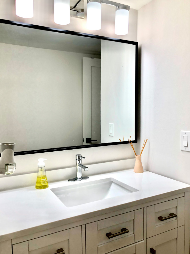 Design ideas for a small traditional bathroom in Miami with shaker cabinets, white cabinets, a one-piece toilet, white tiles, ceramic tiles, white walls, quartz worktops, a sliding door, white worktops, a single sink and a freestanding vanity unit.
