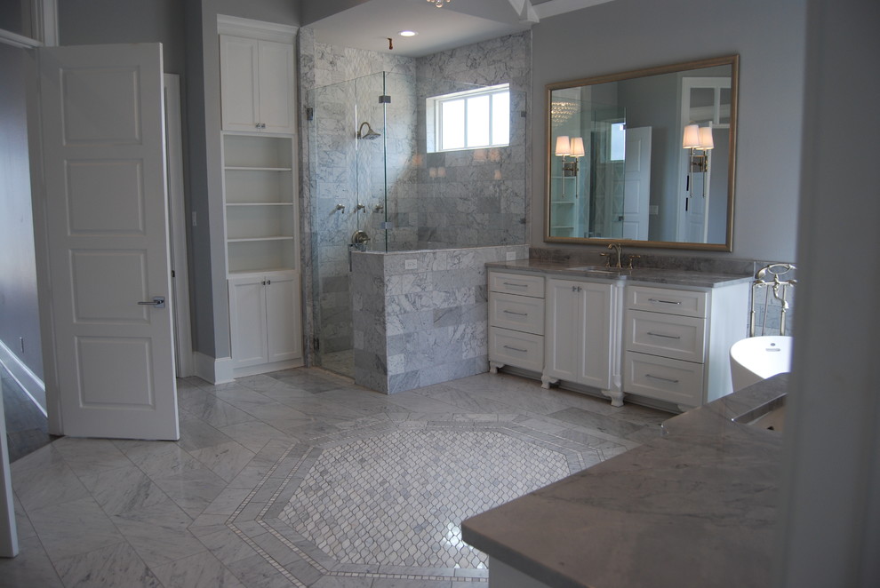 Example of a large transitional master gray tile and marble tile dark wood floor and brown floor bathroom design in Dallas with shaker cabinets, gray cabinets, a one-piece toilet, brown walls, a vessel sink, marble countertops and a hinged shower door
