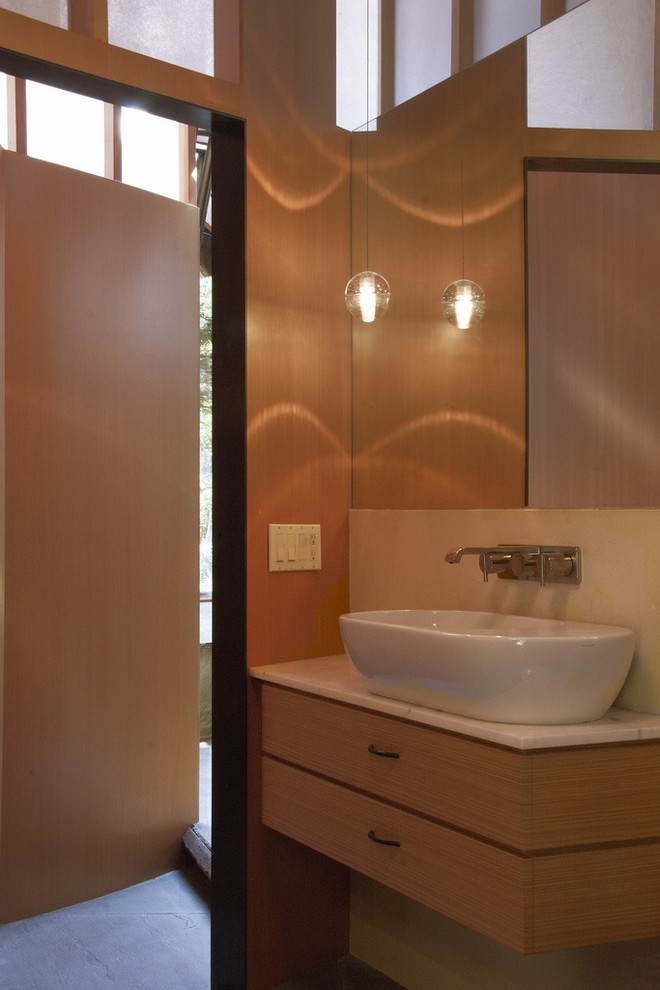 Inspiration for a modern bathroom remodel in San Francisco with marble countertops and a vessel sink