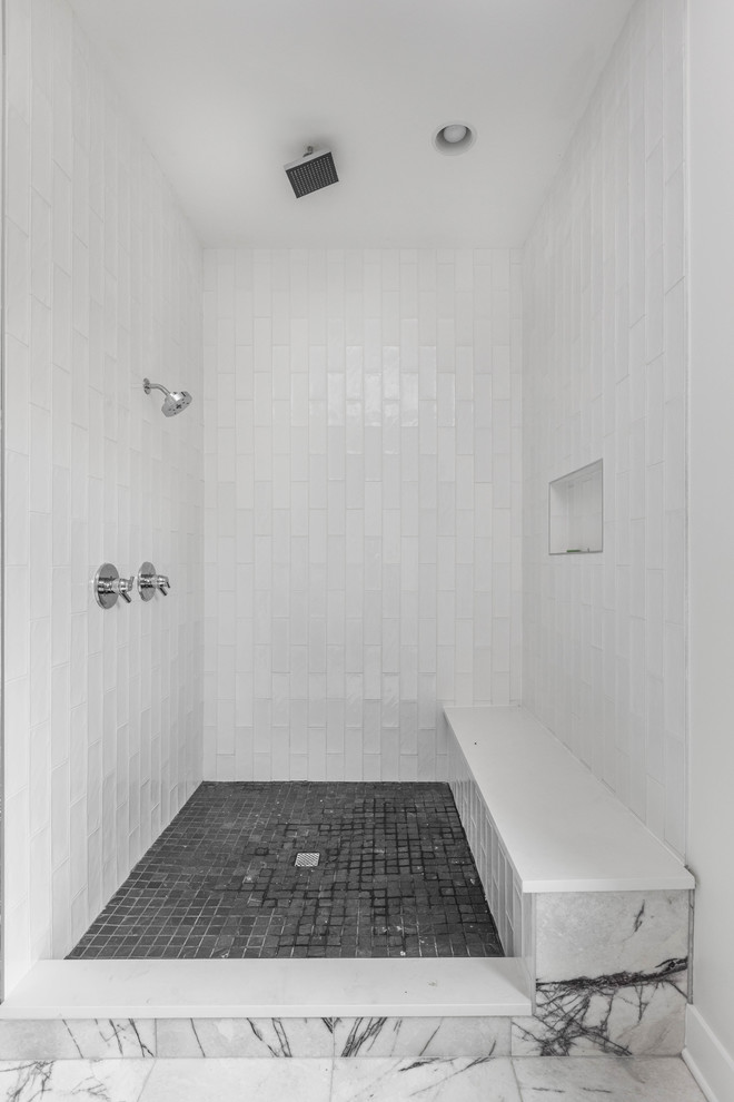Design ideas for a large modern ensuite bathroom in Indianapolis with flat-panel cabinets, dark wood cabinets, a corner bath, a corner shower, a one-piece toilet, white tiles, metro tiles, grey walls, marble flooring, an integrated sink, quartz worktops, white floors, an open shower and white worktops.