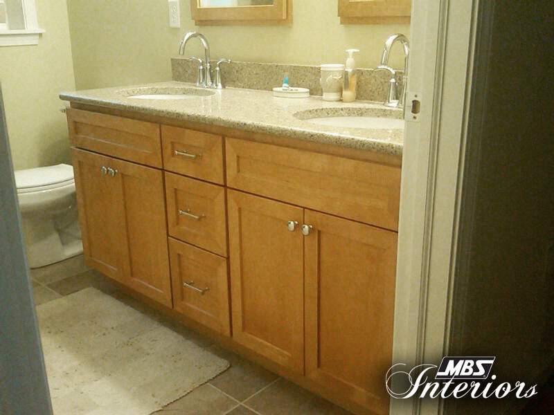 Example of a classic beige tile bathroom design in Other with shaker cabinets, light wood cabinets and quartzite countertops