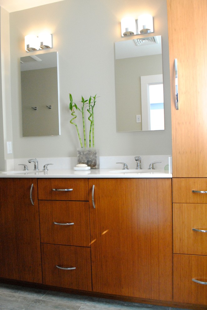 Example of a mid-sized transitional beige tile and porcelain tile ceramic tile double shower design in Boston with an undermount sink, flat-panel cabinets, medium tone wood cabinets, quartz countertops, a one-piece toilet and beige walls