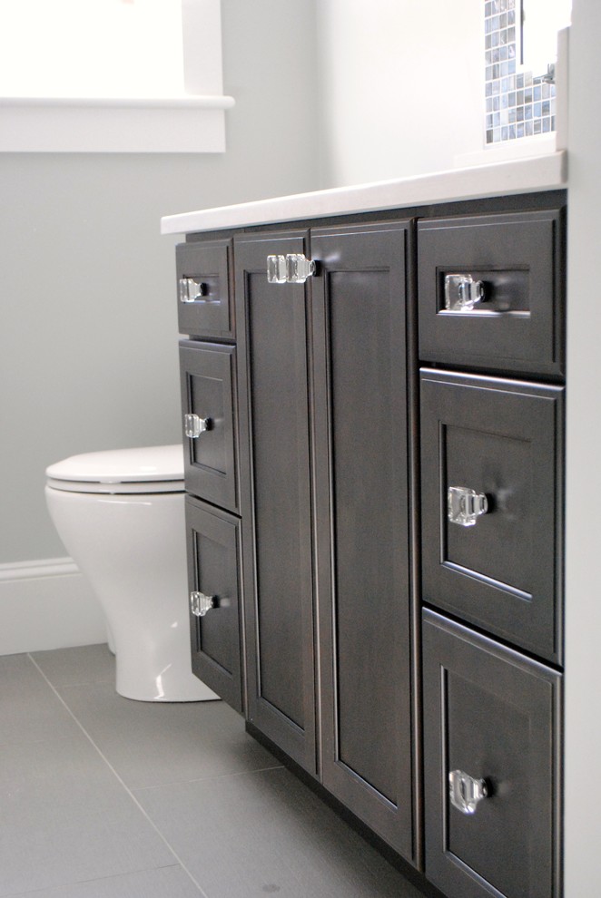 Mid-sized transitional gray tile and porcelain tile ceramic tile bathroom photo in Boston with an undermount sink, shaker cabinets, black cabinets, quartz countertops, a one-piece toilet and gray walls