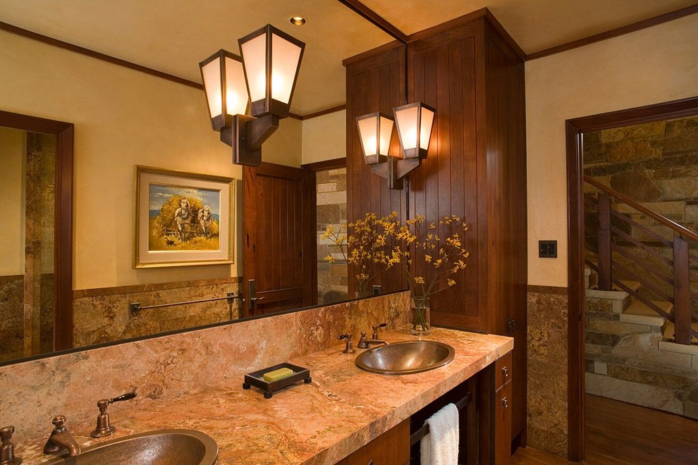 This is an example of a medium sized rustic ensuite bathroom in Austin with flat-panel cabinets, brown cabinets, a freestanding bath, porcelain tiles, beige walls, medium hardwood flooring, a built-in sink, granite worktops and beige floors.