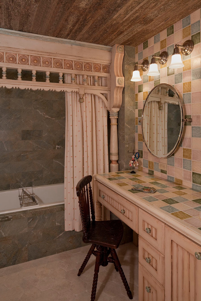 Victorian bathroom in Austin with tiled worktops and feature lighting.