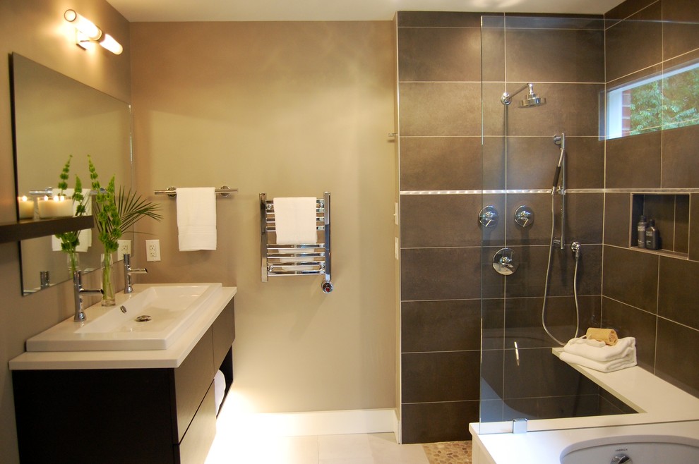Example of a small trendy master gray tile and porcelain tile porcelain tile walk-in shower design in Raleigh with a console sink, flat-panel cabinets, dark wood cabinets, quartz countertops, an undermount tub and gray walls