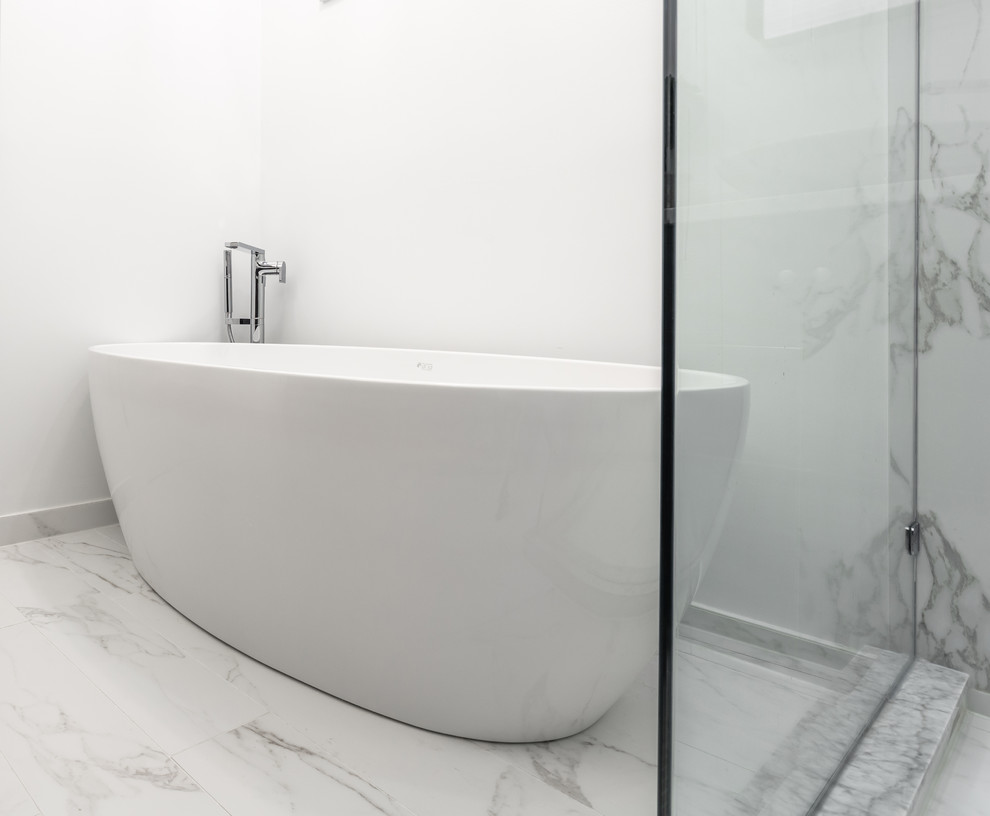 Design ideas for a medium sized contemporary ensuite wet room bathroom in Chicago with shaker cabinets, black cabinets, a built-in bath, a one-piece toilet, white tiles, mosaic tiles, white walls, marble flooring, a built-in sink, engineered stone worktops, white floors, a hinged door and white worktops.