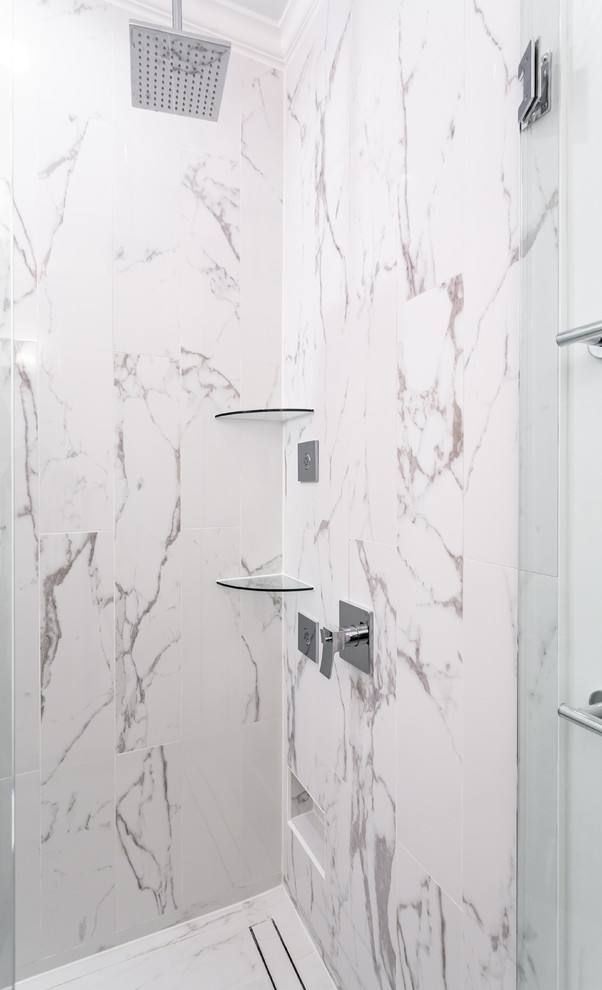 Mid-sized trendy master white tile and mosaic tile marble floor and white floor bathroom photo in Chicago with shaker cabinets, black cabinets, a one-piece toilet, white walls, a drop-in sink, quartz countertops, a hinged shower door and white countertops
