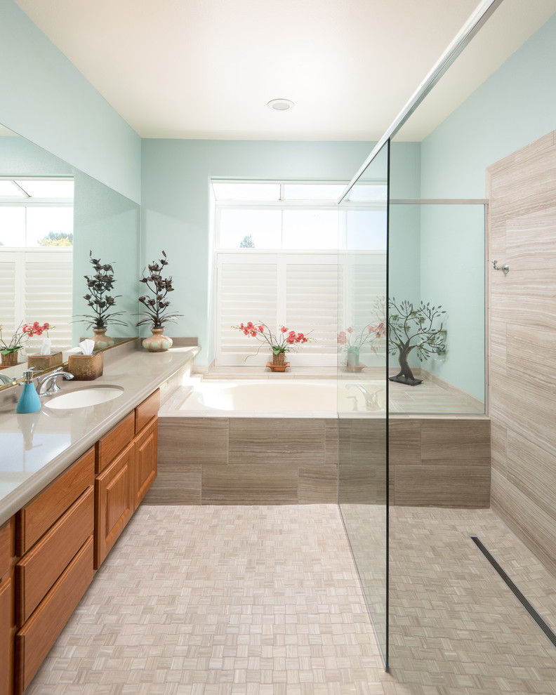 Large elegant master beige tile and porcelain tile porcelain tile bathroom photo in San Diego with raised-panel cabinets, light wood cabinets, a two-piece toilet, blue walls, a drop-in sink and quartzite countertops