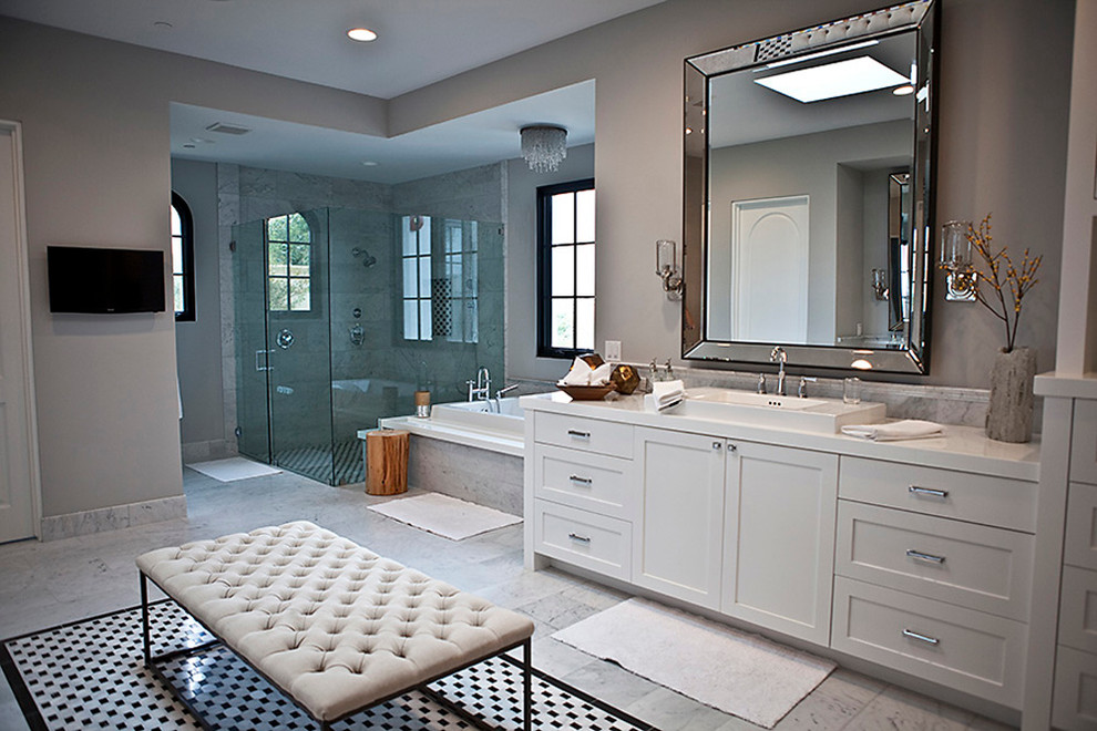 Design ideas for an expansive classic ensuite bathroom in San Diego with shaker cabinets, white cabinets, a built-in bath, a corner shower, a two-piece toilet, white tiles, black and white tiles, grey tiles, stone tiles, grey walls, marble flooring, engineered stone worktops and a built-in sink.