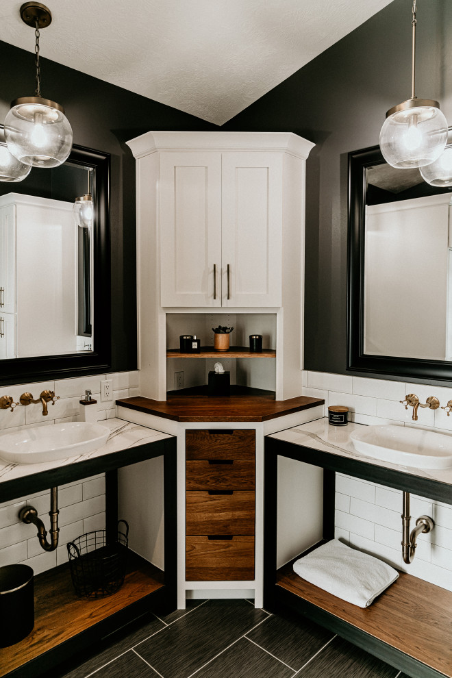 Bathroom - mid-sized farmhouse master white tile and subway tile ceramic tile and gray floor bathroom idea in Other with open cabinets, black cabinets, beige walls, a vessel sink, quartz countertops, a hinged shower door and white countertops