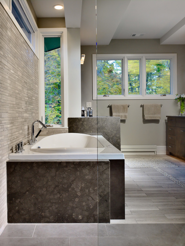 Medium sized modern ensuite bathroom in Atlanta with flat-panel cabinets, grey cabinets, a built-in bath, a built-in shower, a one-piece toilet, grey tiles, porcelain tiles, grey walls, porcelain flooring, a submerged sink and granite worktops.