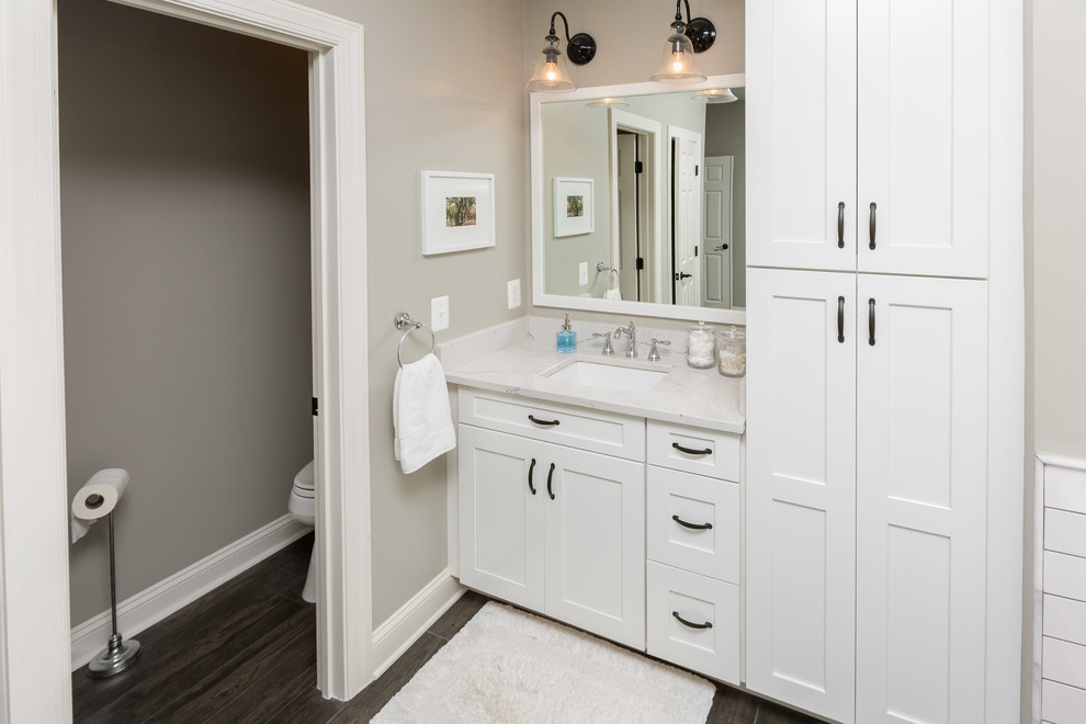 Bathroom - large traditional master white tile and subway tile dark wood floor and brown floor bathroom idea in DC Metro with shaker cabinets, white cabinets, gray walls, an undermount sink, quartz countertops, a hinged shower door and gray countertops
