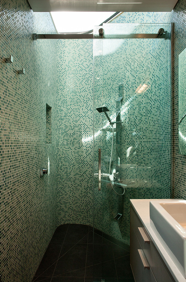 Inspiration for a small contemporary 3/4 green tile bathroom remodel in Wellington with flat-panel cabinets, green walls and a vessel sink
