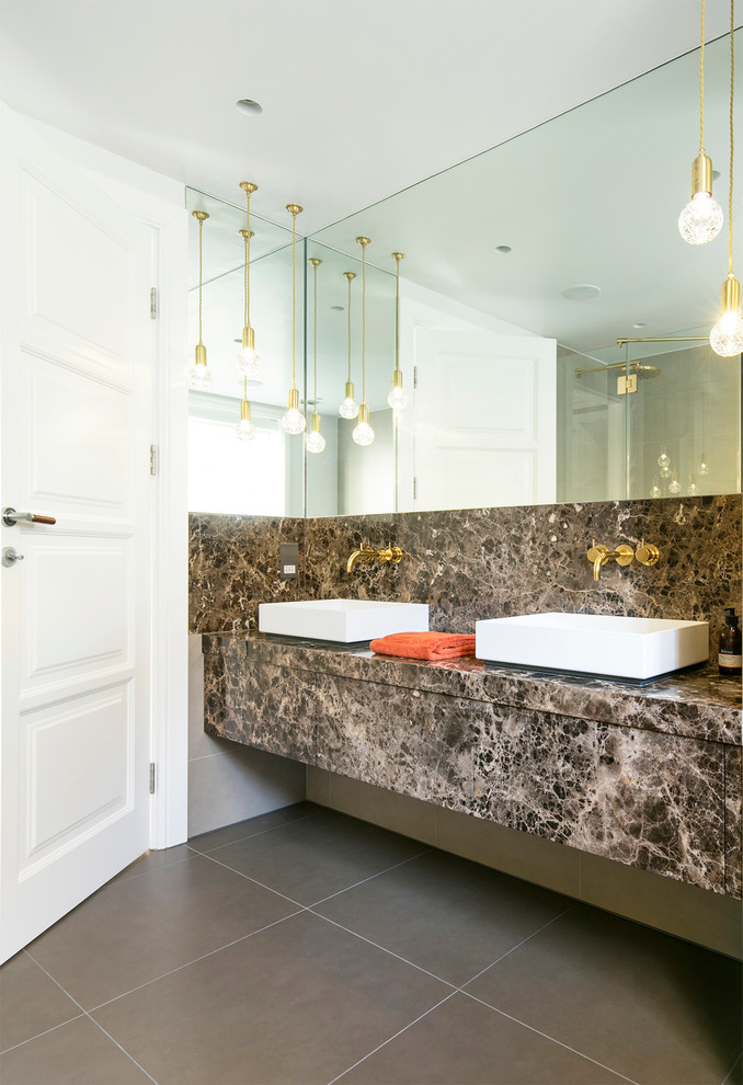 Medium sized contemporary ensuite bathroom in Oxfordshire with flat-panel cabinets, a walk-in shower, porcelain flooring, brown tiles, porcelain tiles, marble worktops, brown cabinets, brown worktops, double sinks and a floating vanity unit.