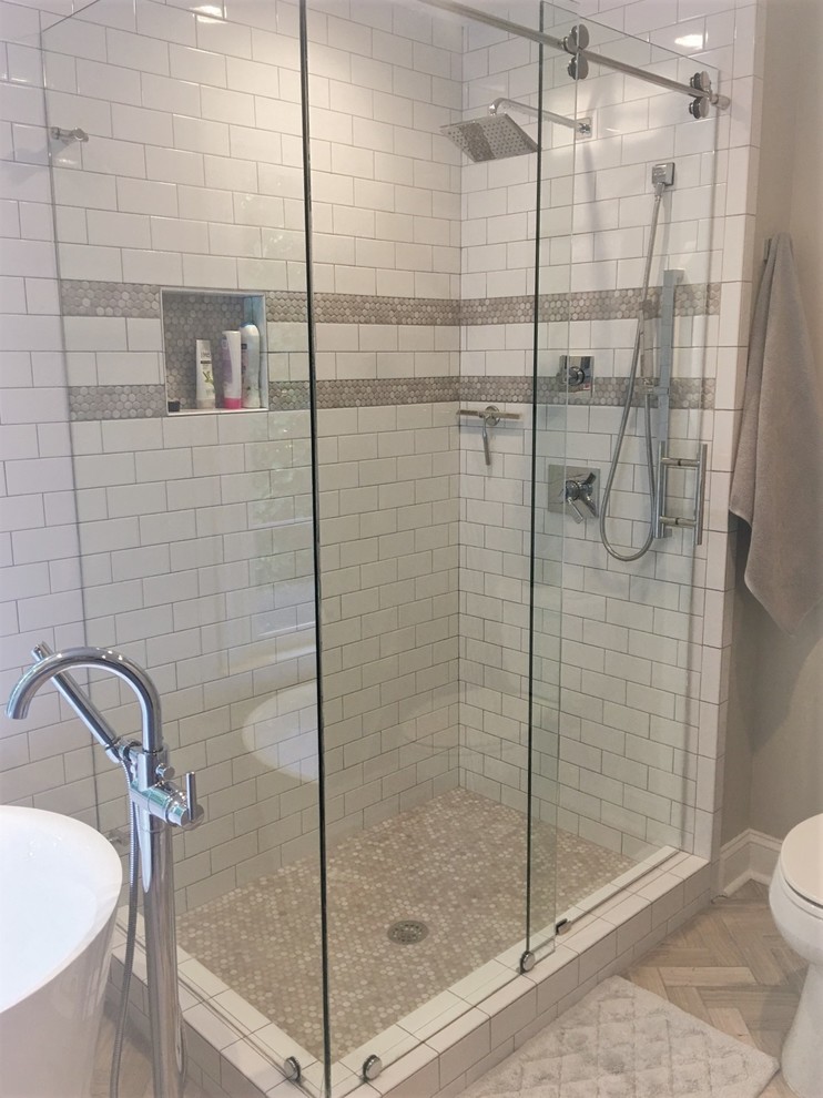 Inspiration for a mid-sized coastal master white tile and subway tile multicolored floor bathroom remodel in Miami with raised-panel cabinets, dark wood cabinets, beige walls, an undermount sink, marble countertops and a hinged shower door