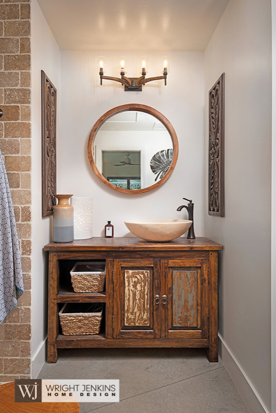 Bathroom - mid-sized zen master brown tile and cement tile gray floor and single-sink bathroom idea in Other with furniture-like cabinets, brown cabinets, a one-piece toilet, white walls, a vessel sink, wood countertops, brown countertops and a freestanding vanity