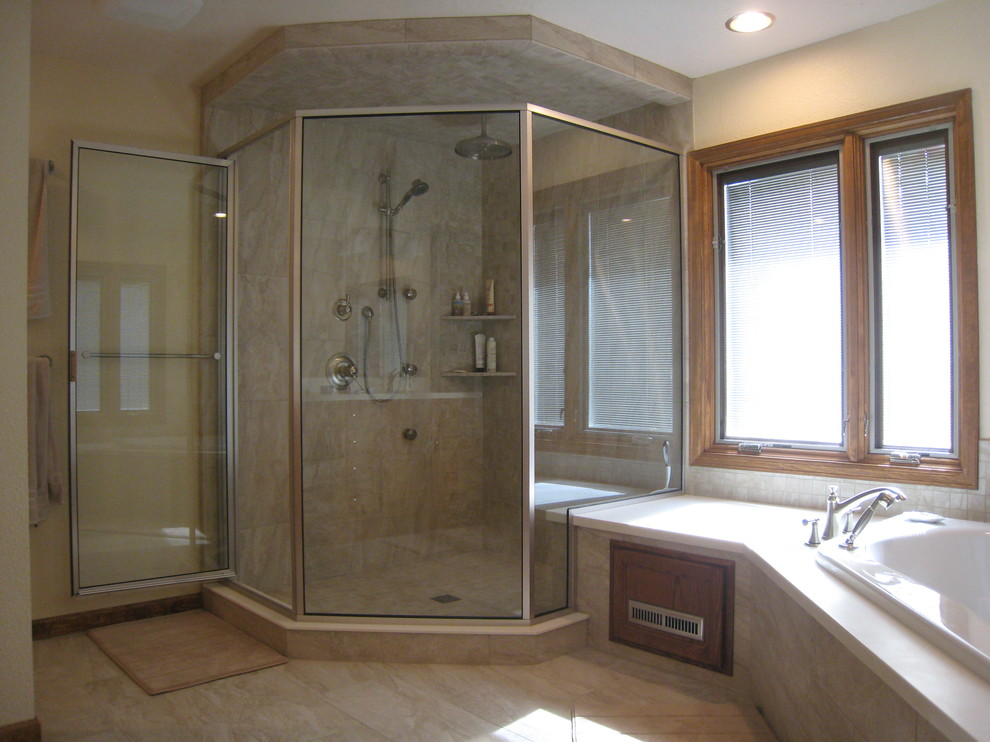 Design ideas for a large contemporary ensuite bathroom in Denver with a corner bath, a corner shower, raised-panel cabinets, dark wood cabinets, soapstone worktops, beige tiles, white walls, a one-piece toilet, limestone flooring, a submerged sink, beige floors and a hinged door.