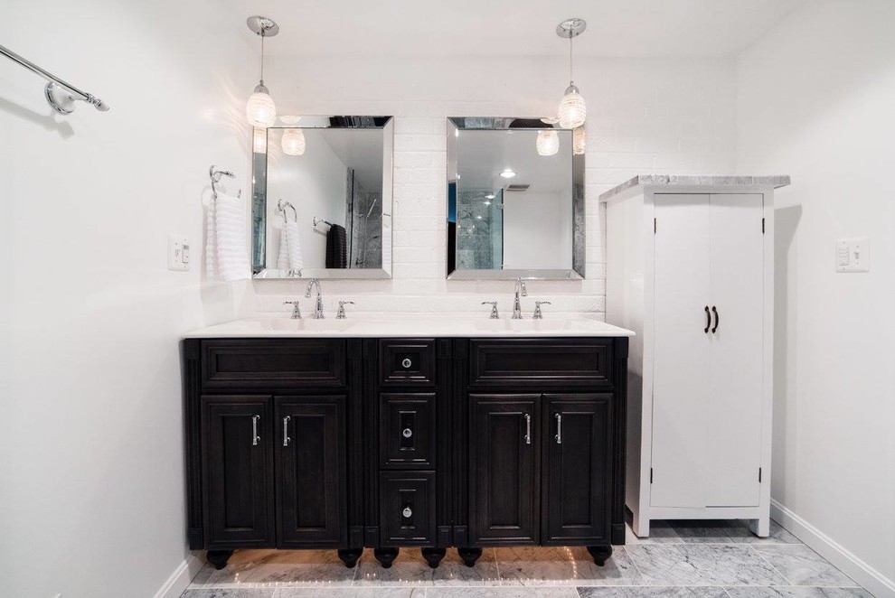Mid-sized transitional master gray tile and ceramic tile ceramic tile and gray floor corner shower photo in DC Metro with recessed-panel cabinets, black cabinets, a two-piece toilet, white walls, solid surface countertops and a hinged shower door