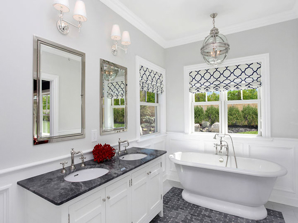 Example of a large trendy master black tile, black and white tile, gray tile and porcelain tile porcelain tile freestanding bathtub design in New York with shaker cabinets, white cabinets, gray walls, an undermount sink and quartzite countertops