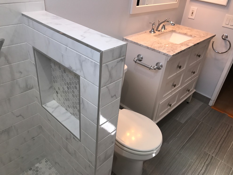 This is an example of a medium sized classic shower room bathroom in San Diego with freestanding cabinets, white cabinets, an alcove shower, a two-piece toilet, grey tiles, white tiles, ceramic tiles, grey walls, porcelain flooring, a submerged sink, granite worktops, grey floors and an open shower.