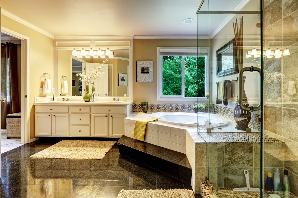 Идея дизайна: главная ванная комната в классическом стиле с фасадами с утопленной филенкой, белыми фасадами, гидромассажной ванной, душем в нише, плиткой мозаикой, накладной раковиной и столешницей из искусственного камня