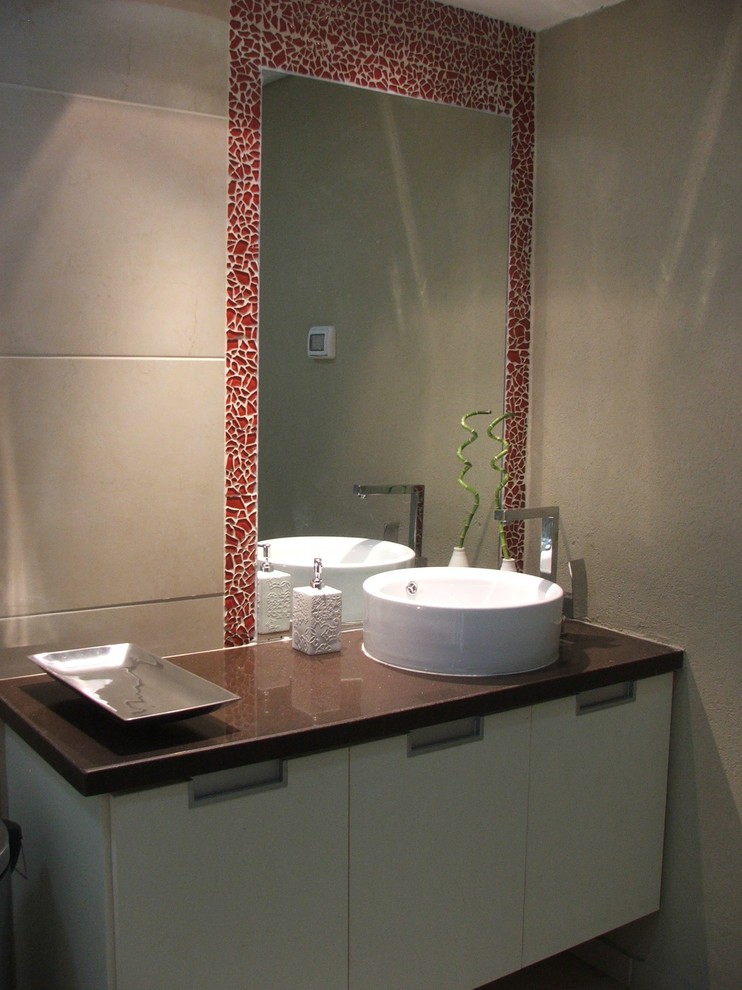 Inspiration for a contemporary mosaic tile bathroom remodel in Tel Aviv with solid surface countertops and a vessel sink