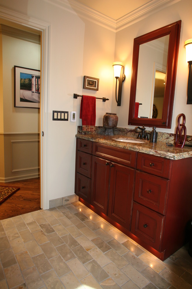 Bathroom - mid-sized rustic beige tile and stone tile limestone floor bathroom idea in Seattle with an undermount sink, furniture-like cabinets, distressed cabinets, granite countertops and white walls