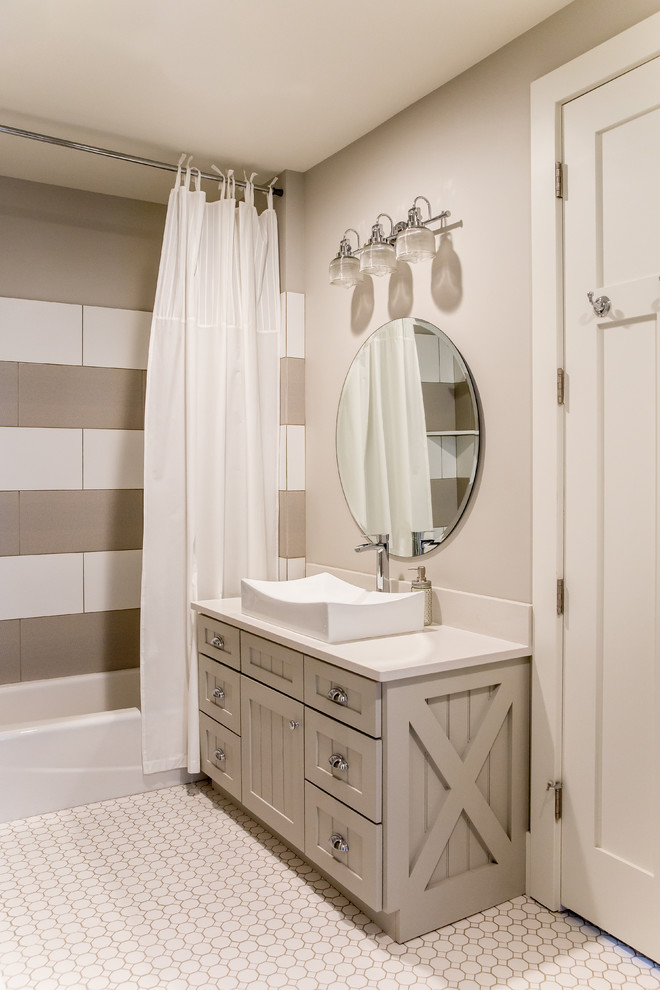 Inspiration for a medium sized traditional shower room bathroom in Salt Lake City with shaker cabinets, grey cabinets, an alcove bath, a shower/bath combination, a two-piece toilet, white tiles, stone slabs, grey walls, mosaic tile flooring, a vessel sink and quartz worktops.