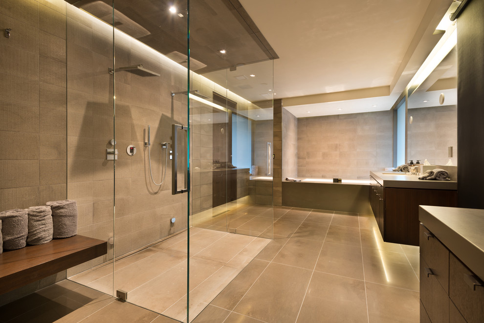 This is an example of a contemporary ensuite bathroom in Denver with flat-panel cabinets, dark wood cabinets, a built-in bath, a built-in shower, grey tiles, stone tiles and terrazzo worktops.
