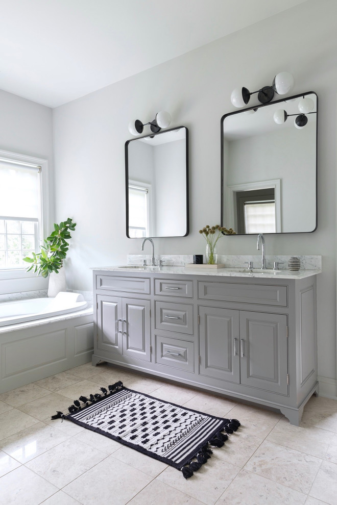 Drop-in bathtub - transitional master beige floor and double-sink drop-in bathtub idea in New York with gray cabinets, an undermount sink, marble countertops, gray countertops, a built-in vanity and beaded inset cabinets