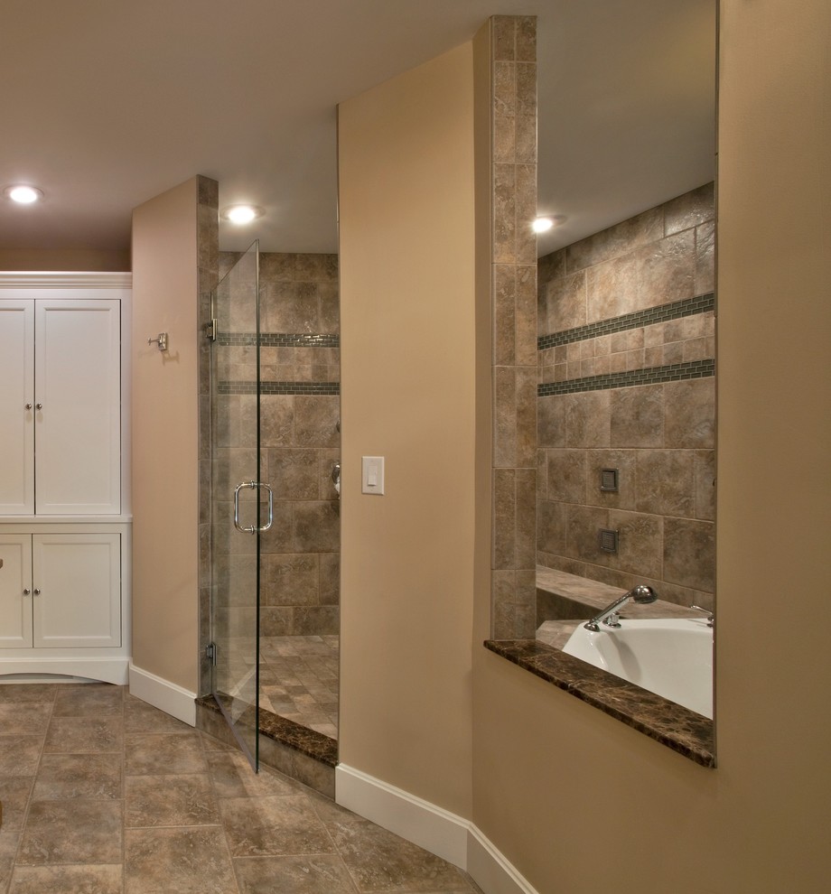 Large traditional ensuite bathroom in Boston with recessed-panel cabinets, medium wood cabinets, a built-in bath, a walk-in shower, beige tiles, ceramic tiles, beige walls, ceramic flooring, a vessel sink and wooden worktops.