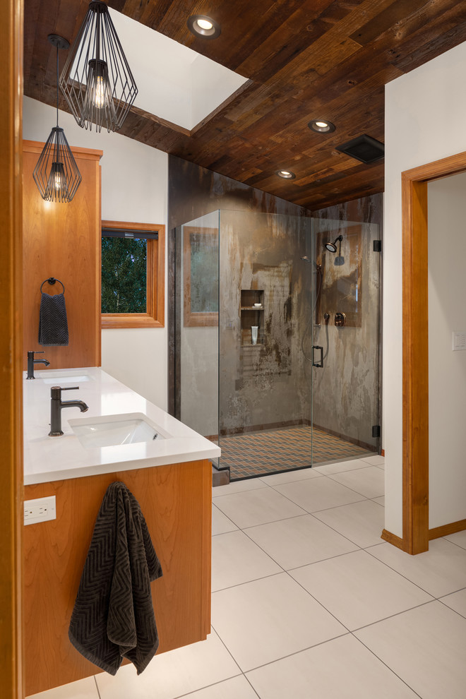 Industrial bathroom in Seattle with shaker cabinets, medium wood cabinets and white worktops.