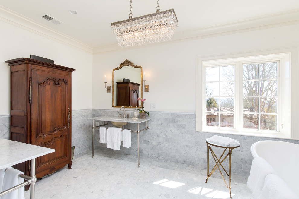 Bathroom - mid-sized farmhouse master gray tile, white tile and marble tile marble floor and white floor bathroom idea in Birmingham with white cabinets, a two-piece toilet, white walls, a pedestal sink, marble countertops, a hinged shower door and white countertops